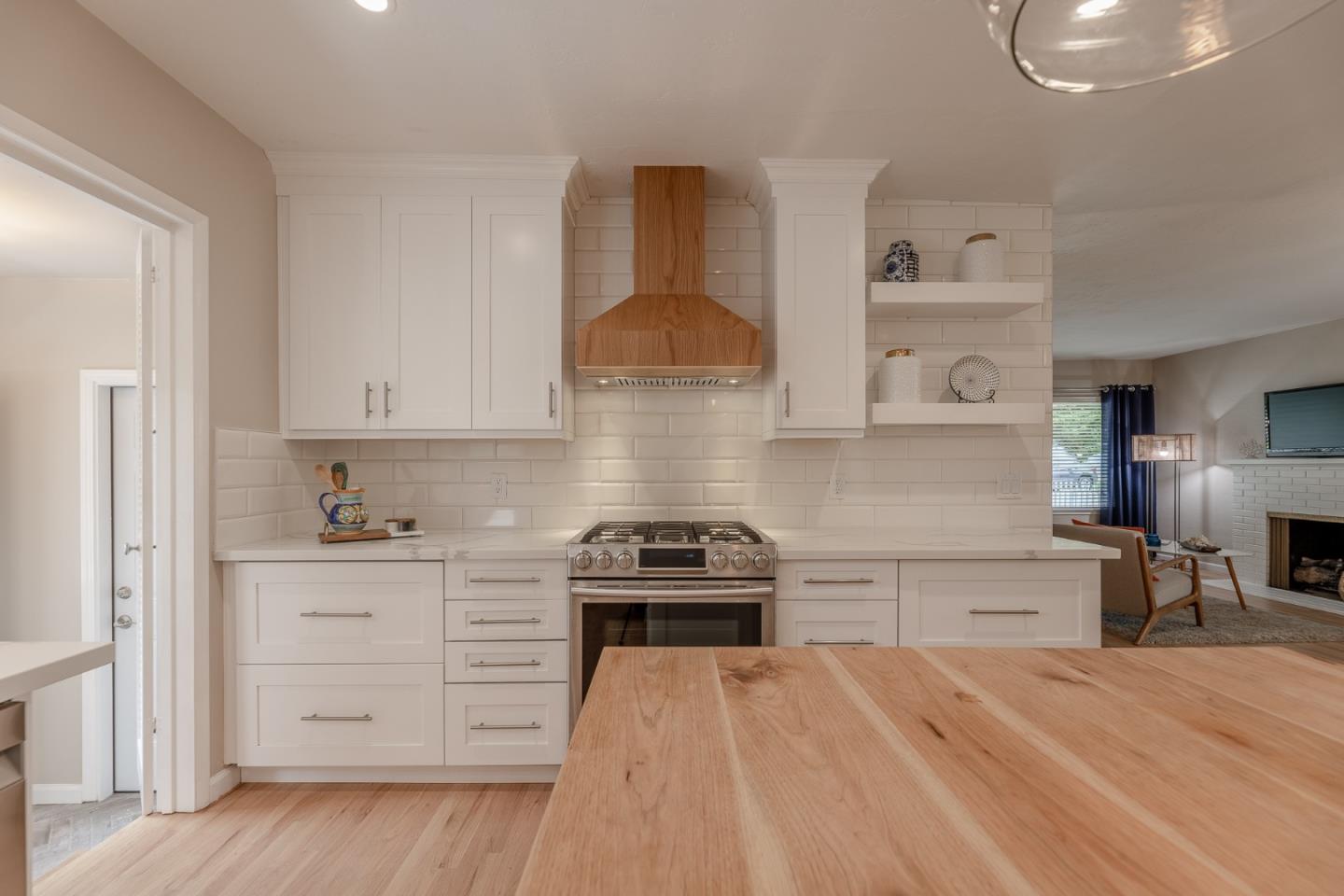 1130 Ripple Avenue Pacific Grove, CA 93950 - Photo 11 of 38 a kitchen with a stove and a cabinets