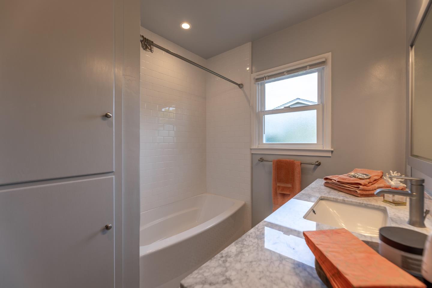 1130 Ripple Avenue Pacific Grove, CA 93950 - Photo 14 of 38 a bathroom with a tub and a sink