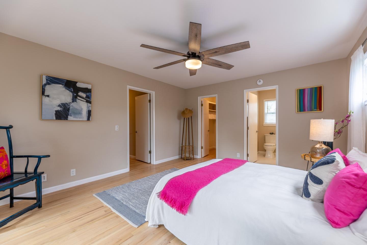 1130 Ripple Avenue Pacific Grove, CA 93950 - Photo 21 of 38 a bedroom with a bed and a chandelier