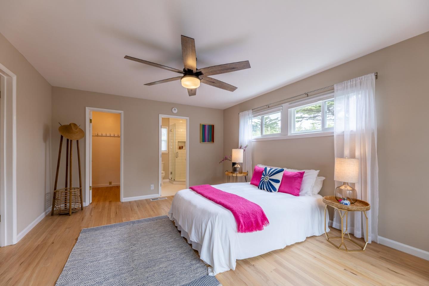 1130 Ripple Avenue Pacific Grove, CA 93950 - Photo 22 of 38 a bedroom with a bed and a chandelier