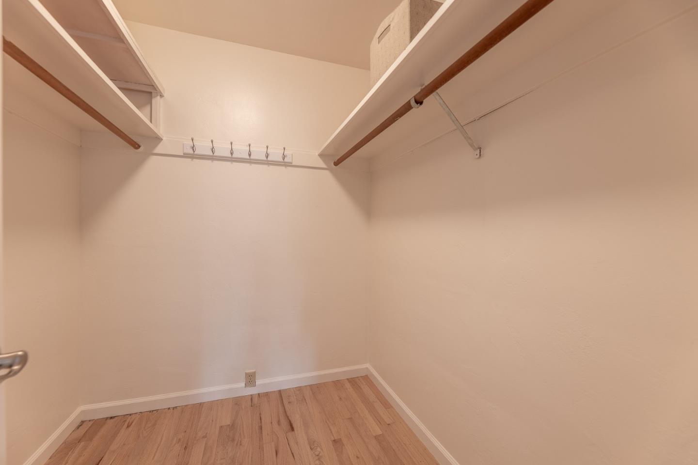 1130 Ripple Avenue Pacific Grove, CA 93950 - Photo 23 of 38 a view of small space with racks on the wall