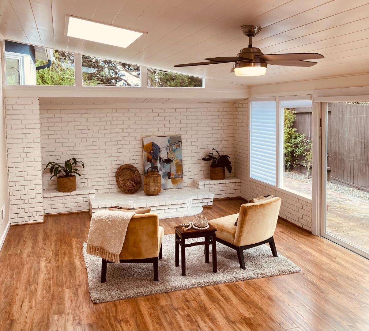1130 Ripple Avenue Pacific Grove, CA 93950 - Photo 26 of 38 a view of a dining room with furniture and wooden floor