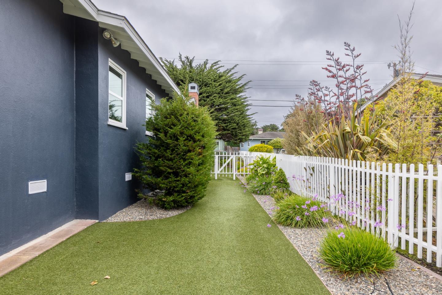 1130 Ripple Avenue Pacific Grove, CA 93950 - Photo 30 of 38 a view of a garden with pathway