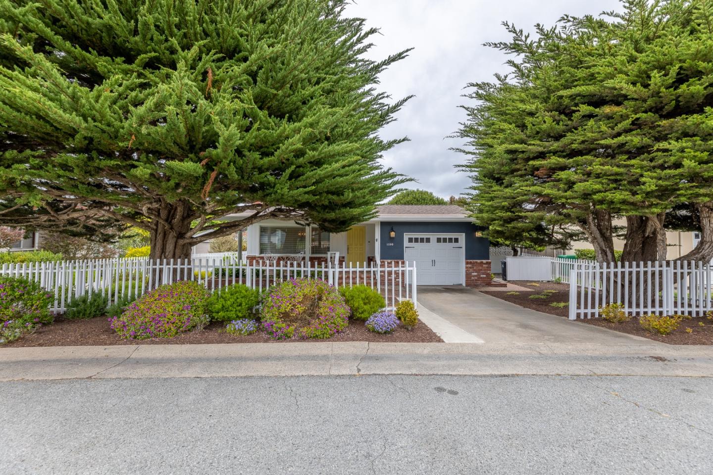 1130 Ripple Avenue Pacific Grove, CA 93950 - Photo 33 of 38 a front view of a house with garden