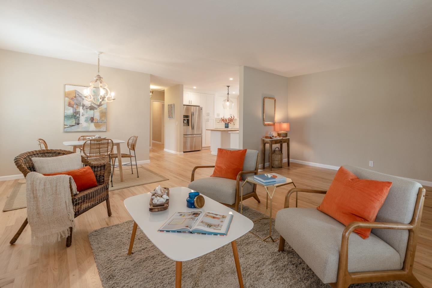 1130 Ripple Avenue Pacific Grove, CA 93950 - Photo 7 of 38 a living room with furniture and a chandelier