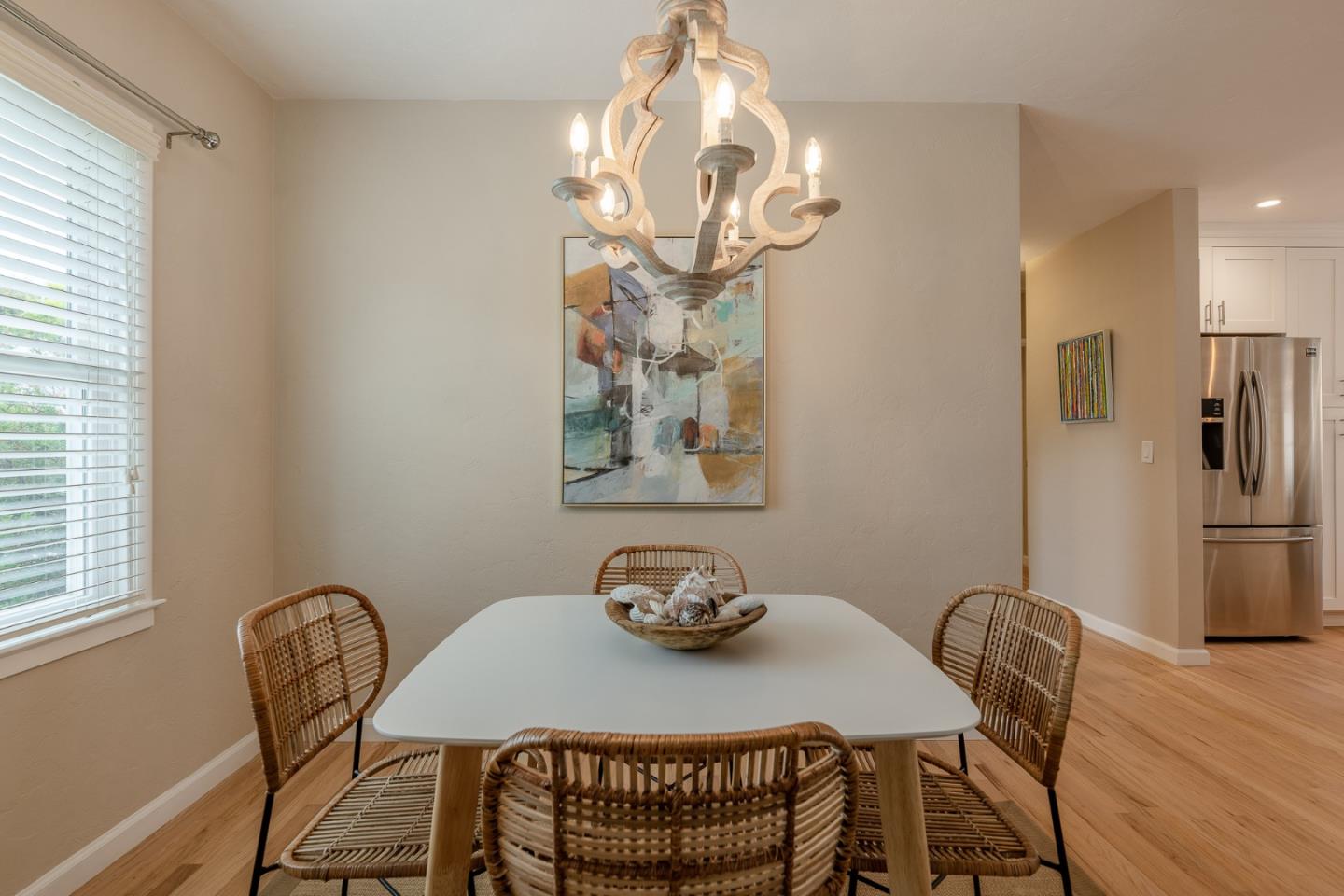 1130 Ripple Avenue Pacific Grove, CA 93950 - Photo 8 of 38 a view of a dining room with furniture and chandelier