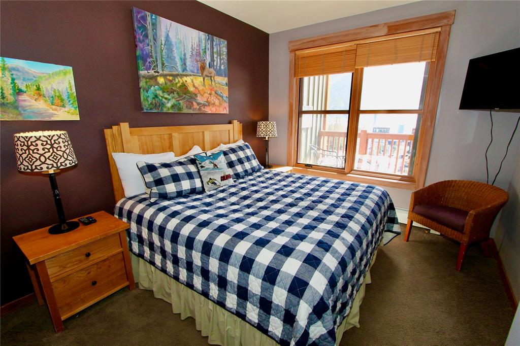 184 Copper Circle, Unit 524 Copper Mountain, CO 80443 - Photo 12 of 19 a bedroom with a bed and a window with chair