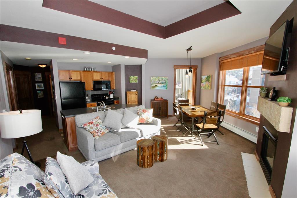 184 Copper Circle, Unit 524 Copper Mountain, CO 80443 - Photo 8 of 19 a living room with furniture and a flat screen tv