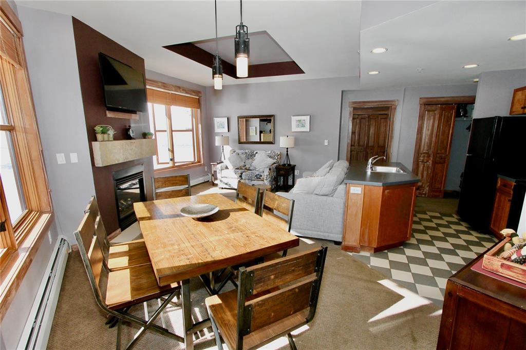 184 Copper Circle, Unit 524 Copper Mountain, CO 80443 - Photo 9 of 19 a view of a dining room with furniture window and wooden floor