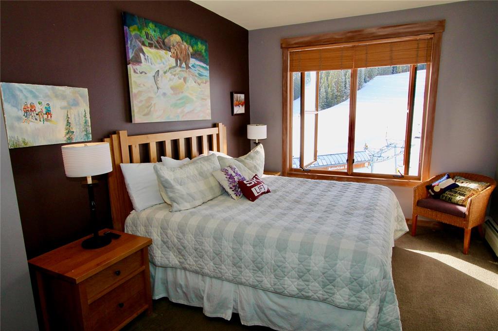 184 Copper Circle, Unit 524 Copper Mountain, CO 80443 - Photo 10 of 19 a bedroom with a bed and wooden floor