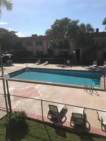 a view of swimming pool with a yard