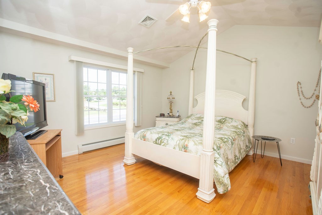 590 Seven Mile Road Scituate, RI 02831 - Photo 11 of 18 Master Bedroom Suite~ Beautiful Cathedral Ceilings~ Gleaming Hardwoods~