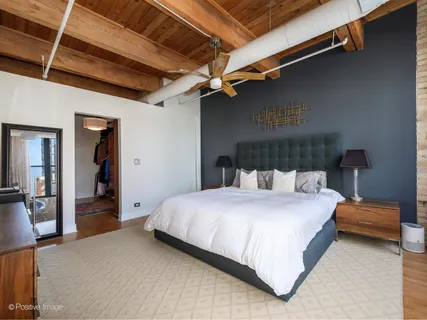 a bedroom with a bed and a walk in closet