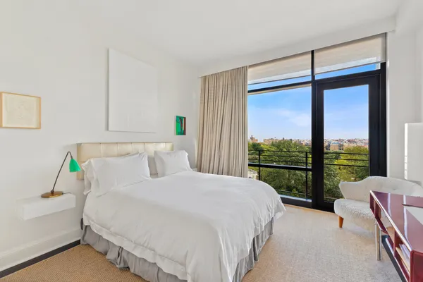a bathroom with a shower sink vanity and toilet