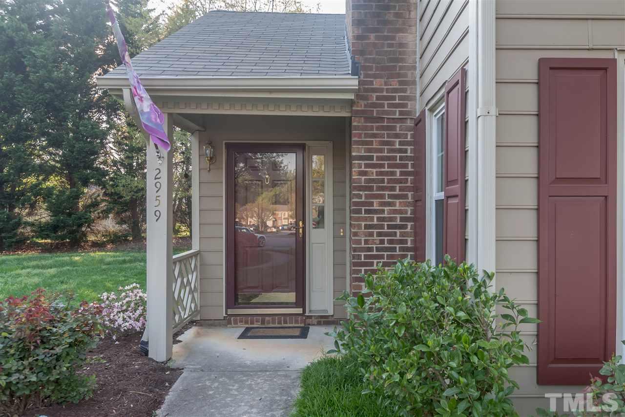 2959 Faversham Place Raleigh, NC 27604 - Photo 2 of 23 a view of a wooden door and a outdoor space