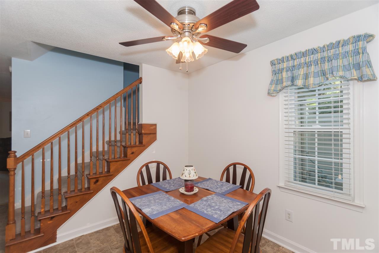 2959 Faversham Place Raleigh, NC 27604 - Photo 11 of 23 a view of a dining room with furniture window and wooden floor