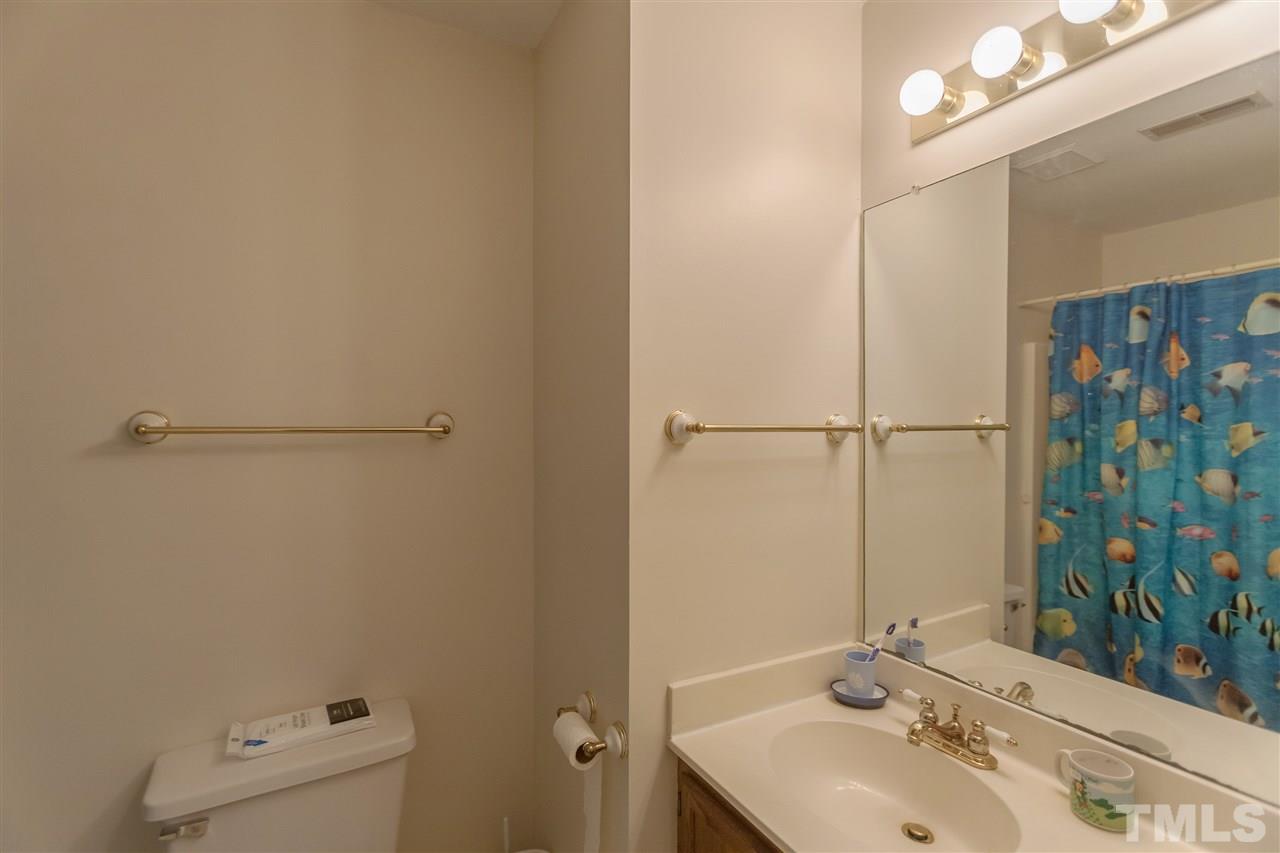 2959 Faversham Place Raleigh, NC 27604 - Photo 20 of 23 a bathroom with a sink and a mirror