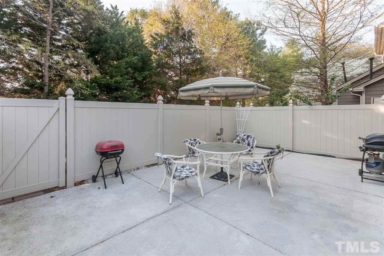 2959 Faversham Place Raleigh, NC 27604 - Photo 22 of 23 a backyard of a house with table and chairs