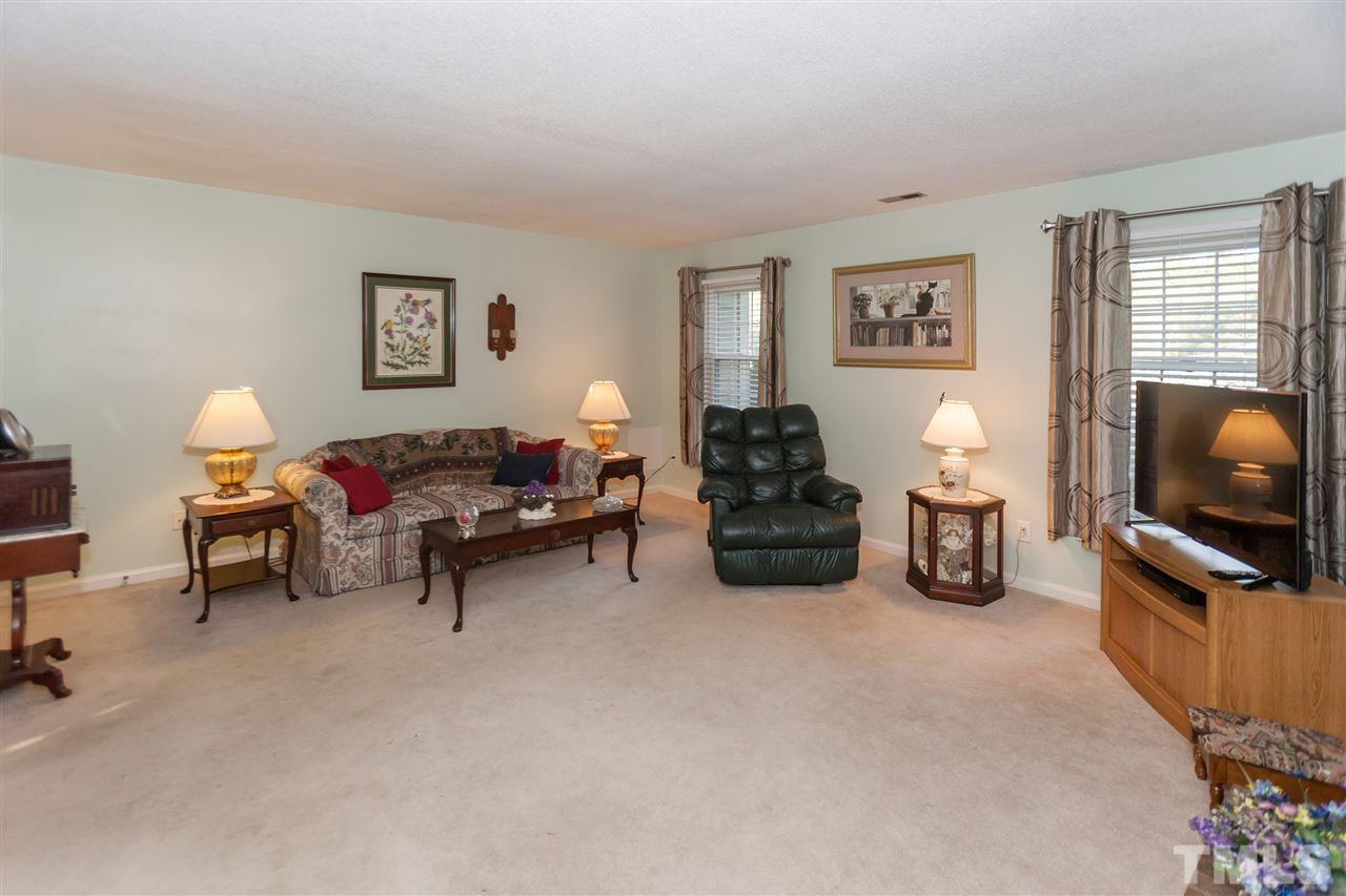 2959 Faversham Place Raleigh, NC 27604 - Photo 5 of 23 a living room with furniture and a flat screen tv