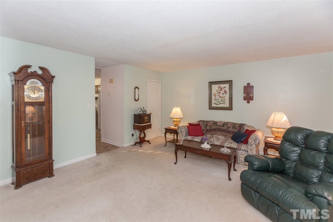 2959 Faversham Place Raleigh, NC 27604 - Photo 8 of 23 a living room with furniture and a window