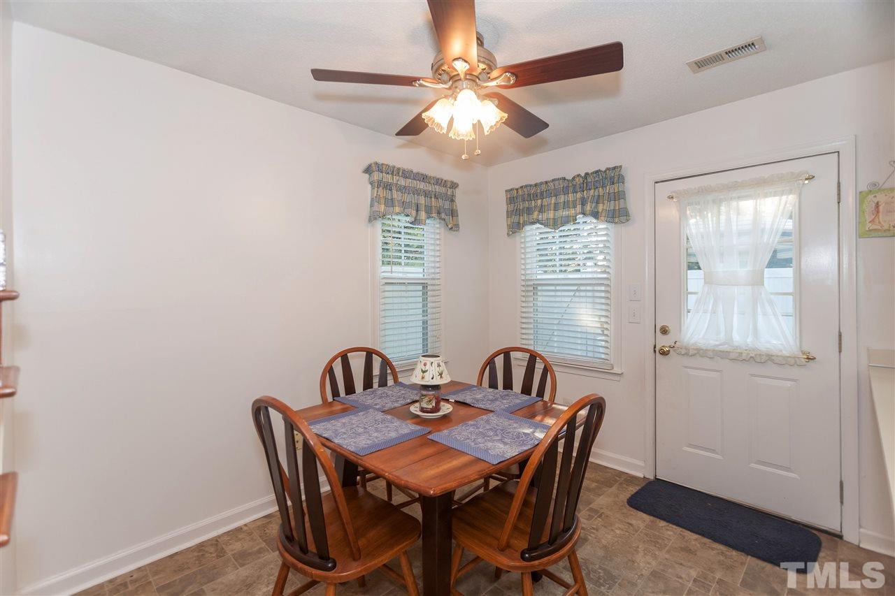 2959 Faversham Place Raleigh, NC 27604 - Photo 10 of 23 a view of a dining room with furniture and chandelier