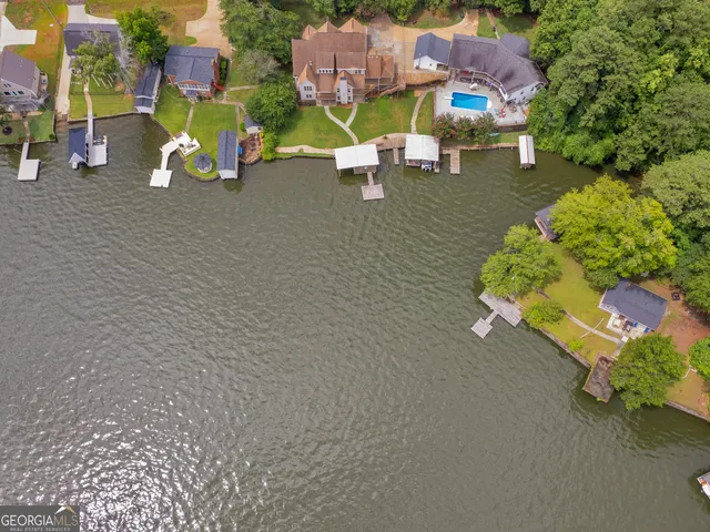 a view of a room with wooden floor and chandelier