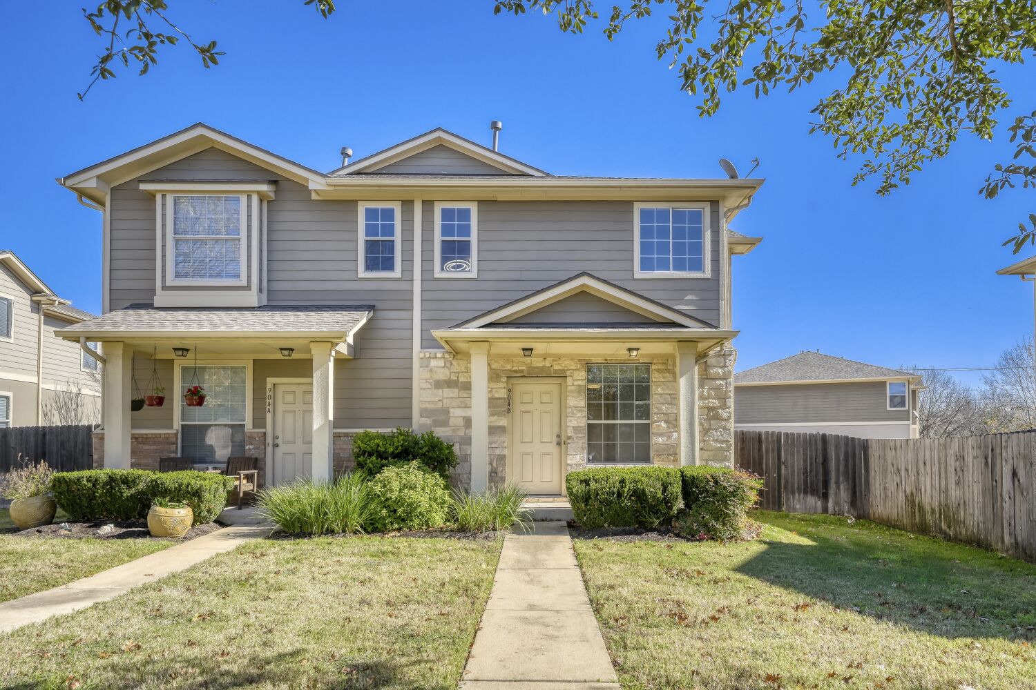 904 Sebastian Bend, Unit B Pflugerville, TX 78660 - Photo 2 of 30 a front view of a house with a yard