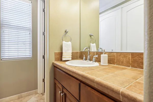 a bathroom with a sink and a mirror