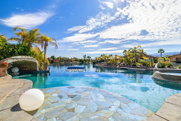 a view of a swimming pool with a patio