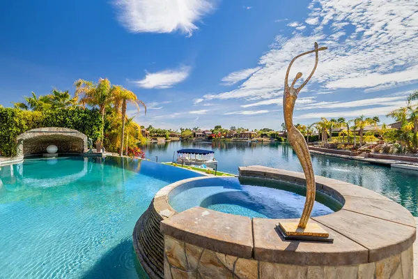 a view of a lake with couches chairs