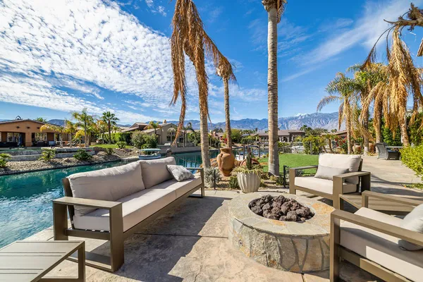 a view of a patio with couches and chairs