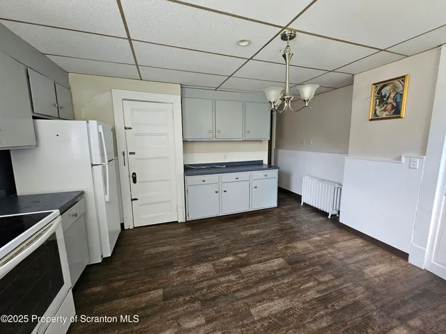 a view of a storage & utility room with cabinets