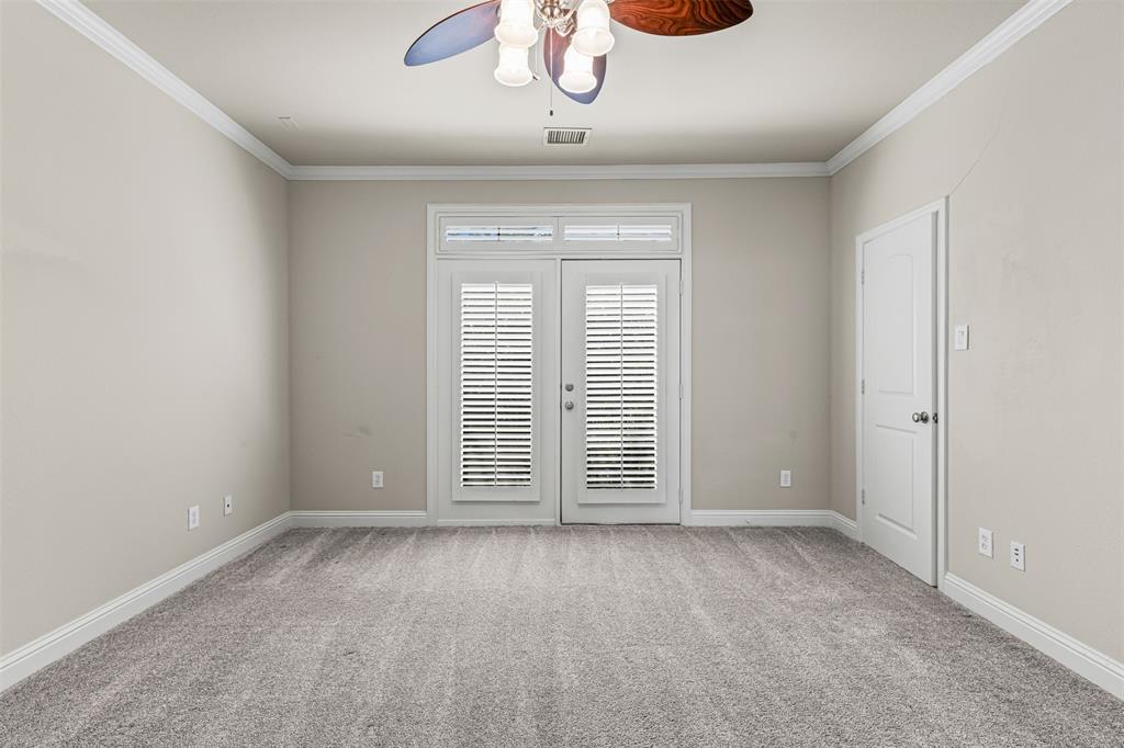 5717 Lunsford Road Plano, TX 75024 - Photo 12 of 25 an empty room with chandelier fan