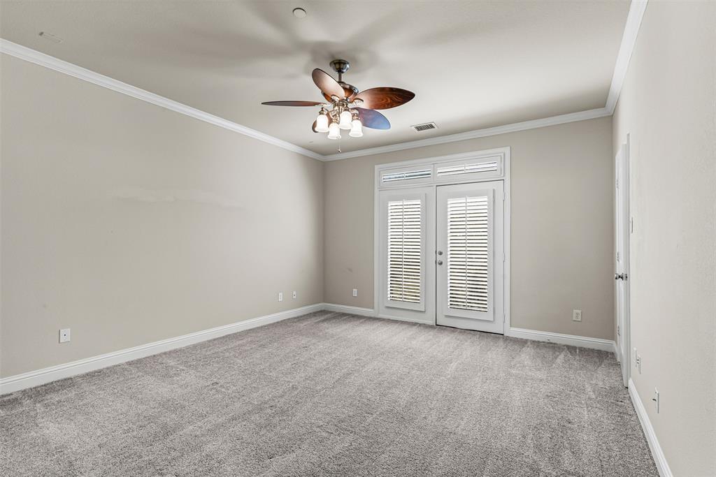 5717 Lunsford Road Plano, TX 75024 - Photo 13 of 25 an empty room with chandelier fan and windows