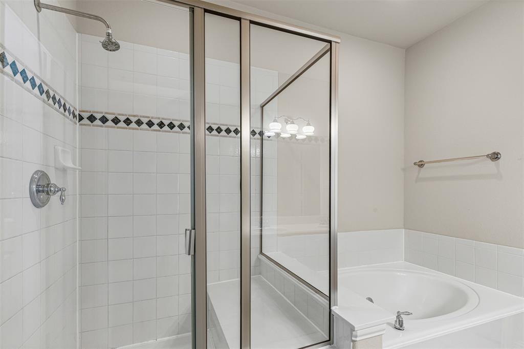 5717 Lunsford Road Plano, TX 75024 - Photo 16 of 25 a bathroom with a bathtub