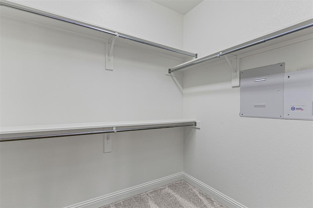 5717 Lunsford Road Plano, TX 75024 - Photo 21 of 25 a view of an empty walk in closet