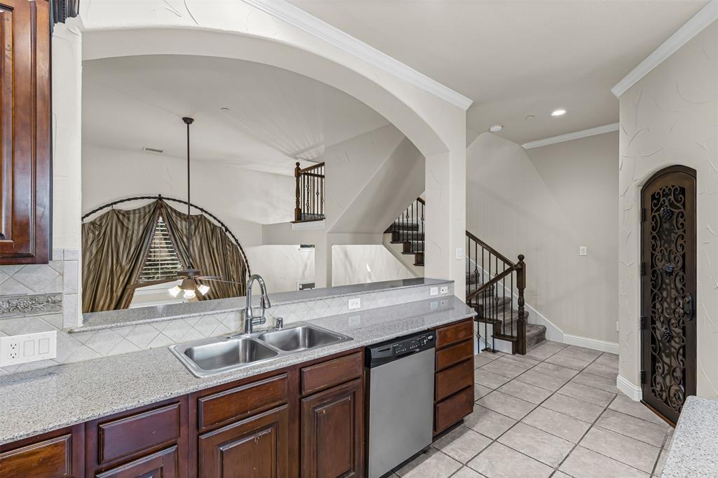 5717 Lunsford Road Plano, TX 75024 - Photo 4 of 25 a kitchen with a sink and cabinets