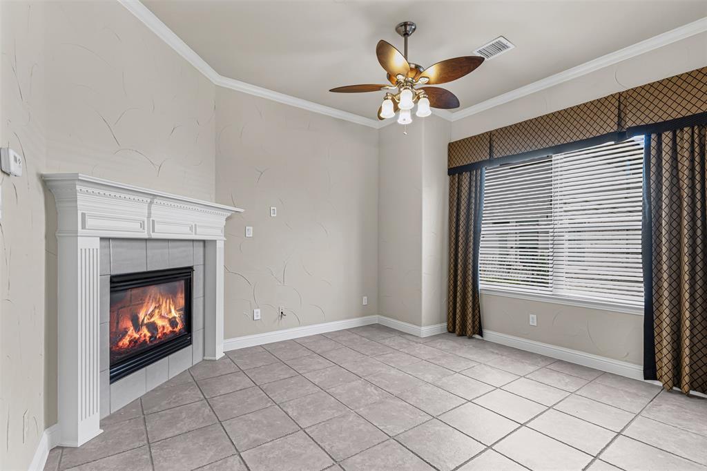 5717 Lunsford Road Plano, TX 75024 - Photo 9 of 25 a view of an empty room with window and fire place