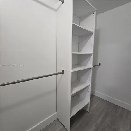 a view of an empty walk in closet