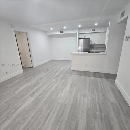 a view of kitchen with wooden floor