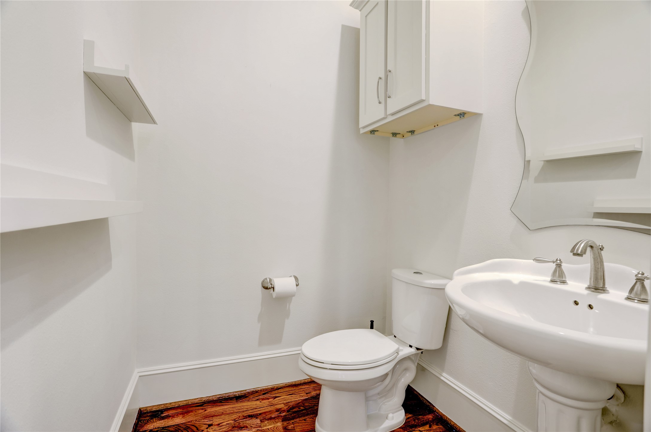 3225 Maxroy Street Houston, TX 77008 - Photo 13 of 30 Second-floor powder room conveniently located just off the living area.