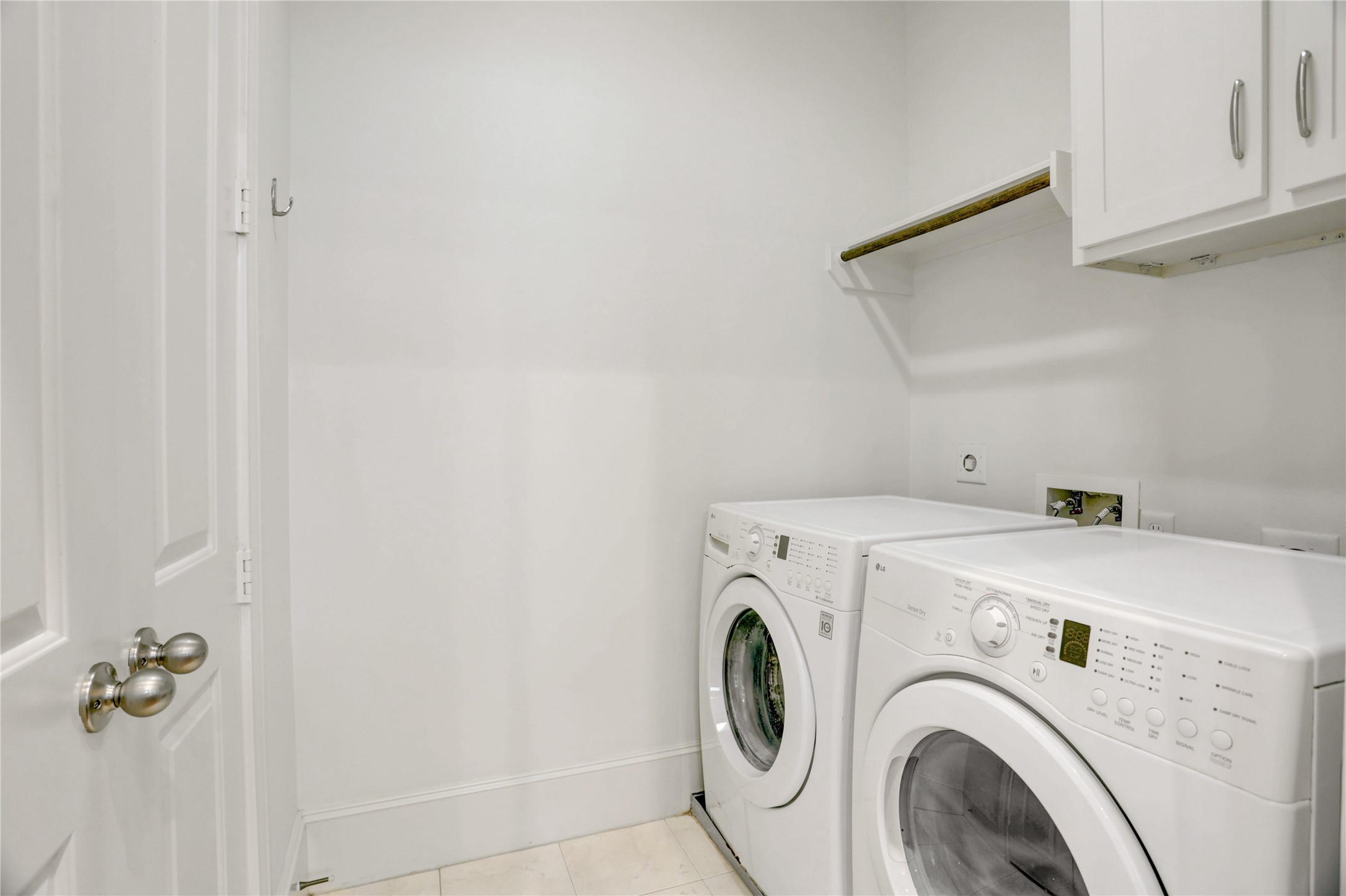 3225 Maxroy Street Houston, TX 77008 - Photo 14 of 30 Washer and dryer room featuring French doors that open directly into the pantry for added convenience.
