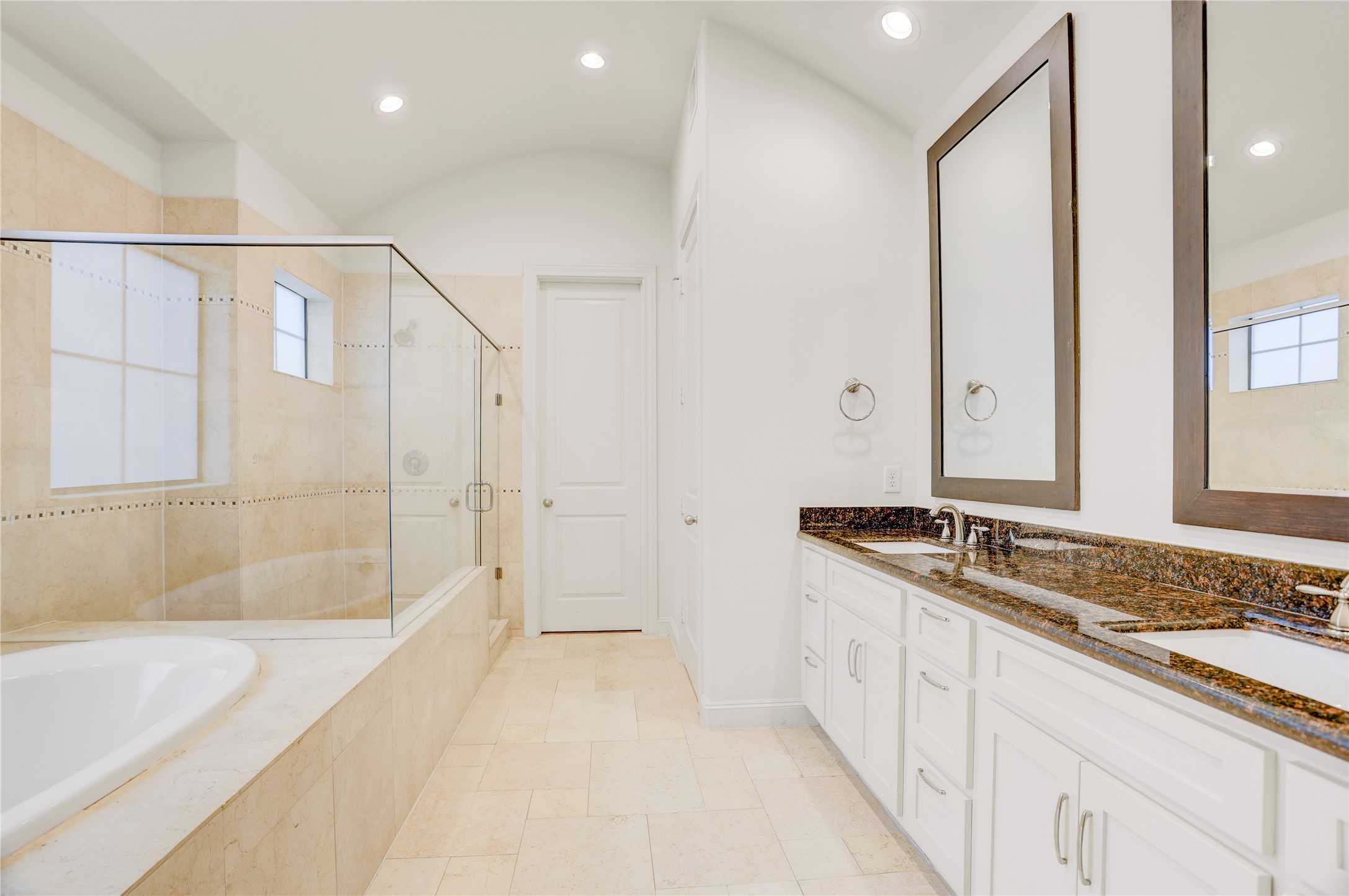 3225 Maxroy Street Houston, TX 77008 - Photo 18 of 30 Oversized primary bathroom with granite countertops, abundant storage, and plenty of natural light—a true oasis.