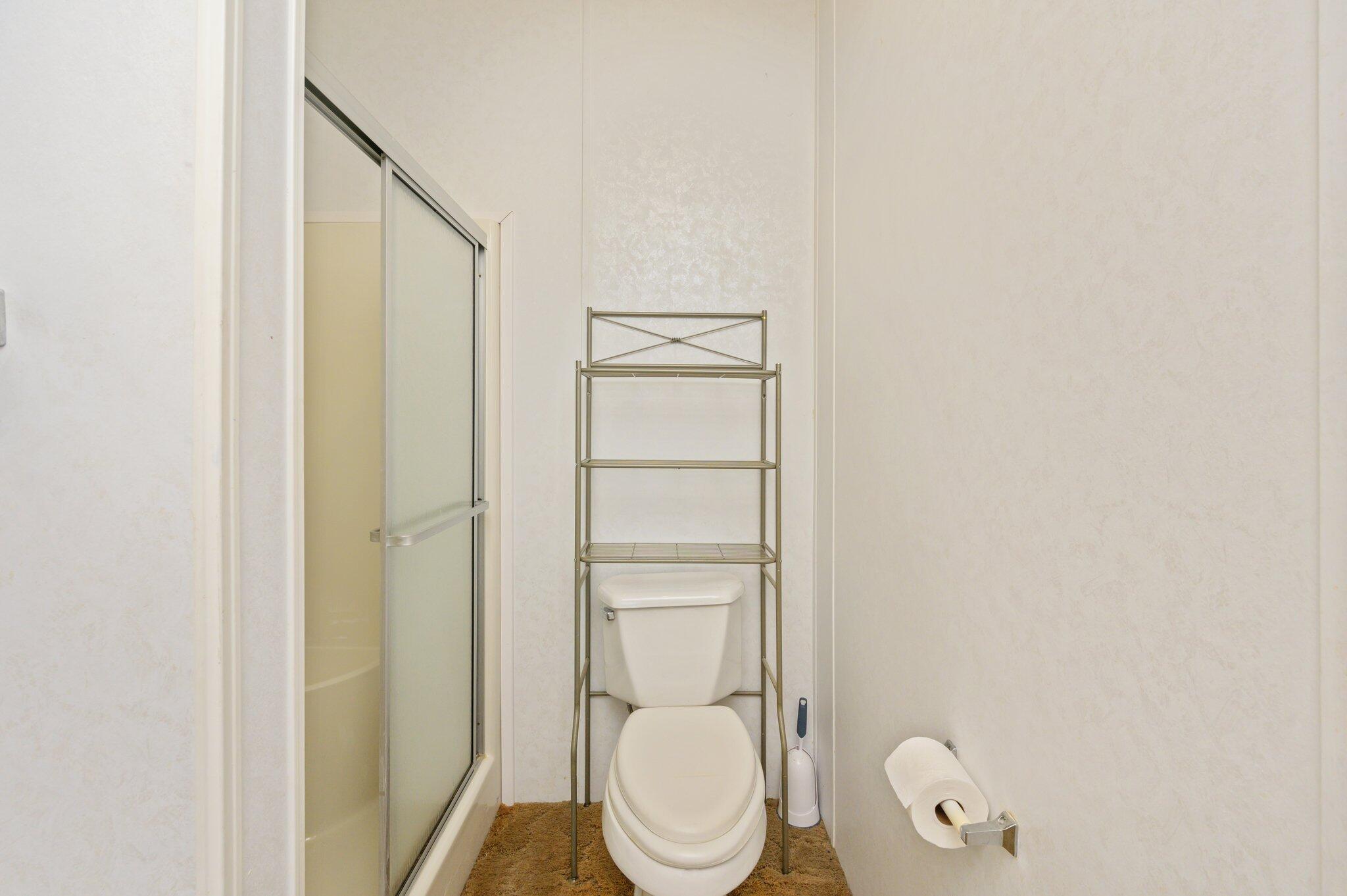 679 Squirrel Road DeFuniak Springs, FL 32433 - Photo 24 of 57 a bathroom with a toilet and a shower