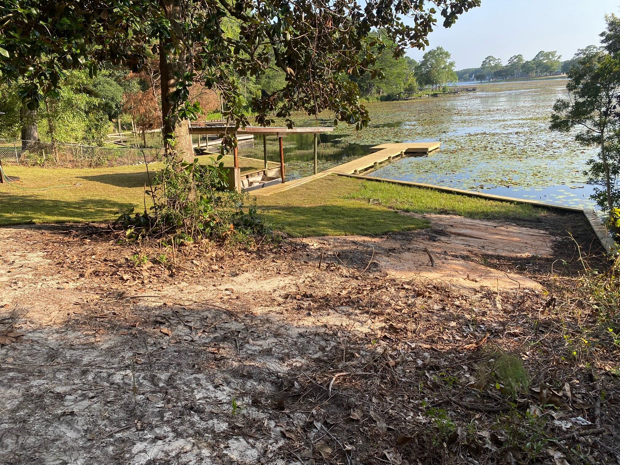 679 Squirrel Road DeFuniak Springs, FL 32433 - Photo 3 of 57 a view of a lake with beach and ocean view