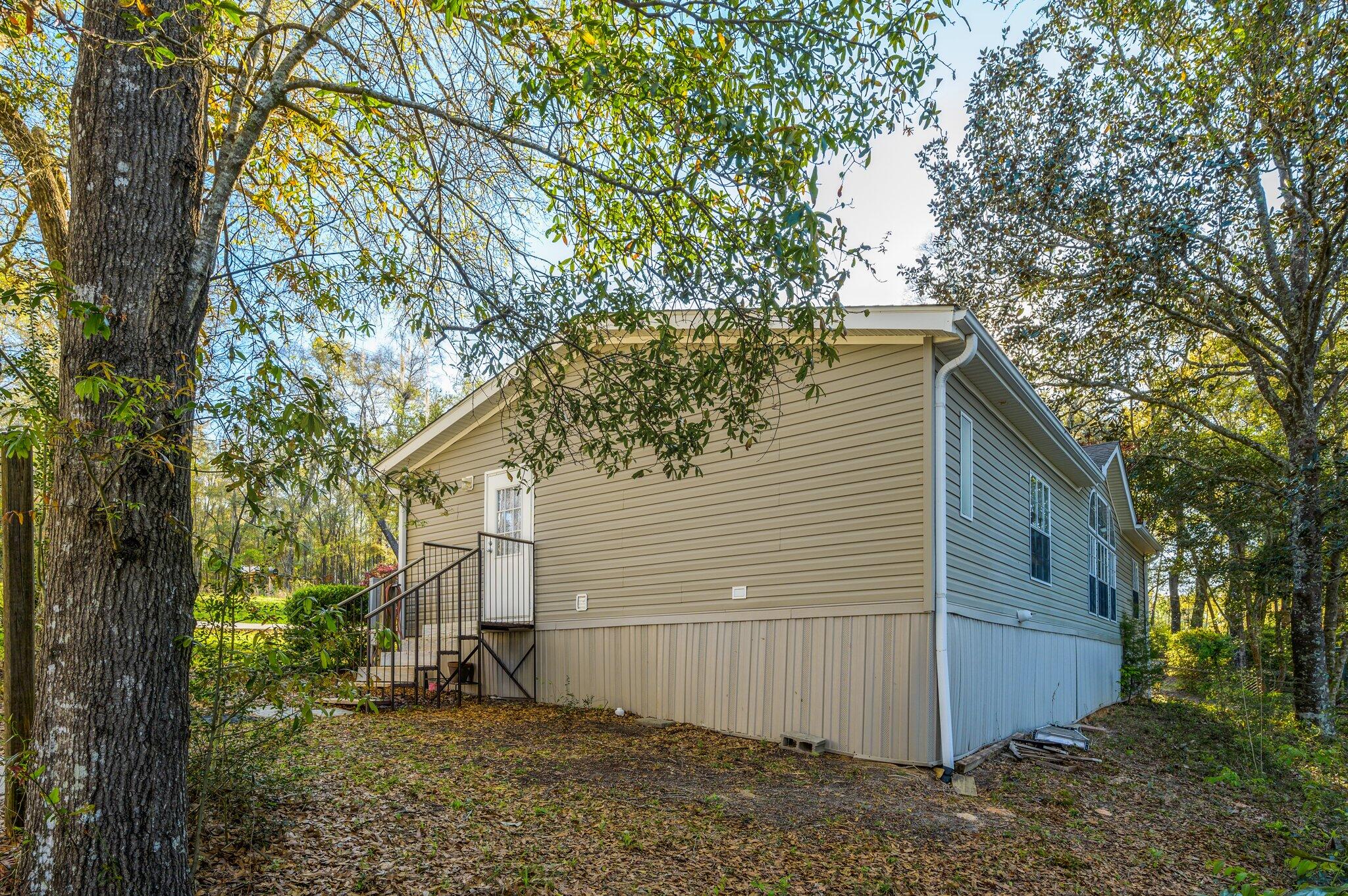 679 Squirrel Road DeFuniak Springs, FL 32433 - Photo 43 of 57 a view of a house with a tree