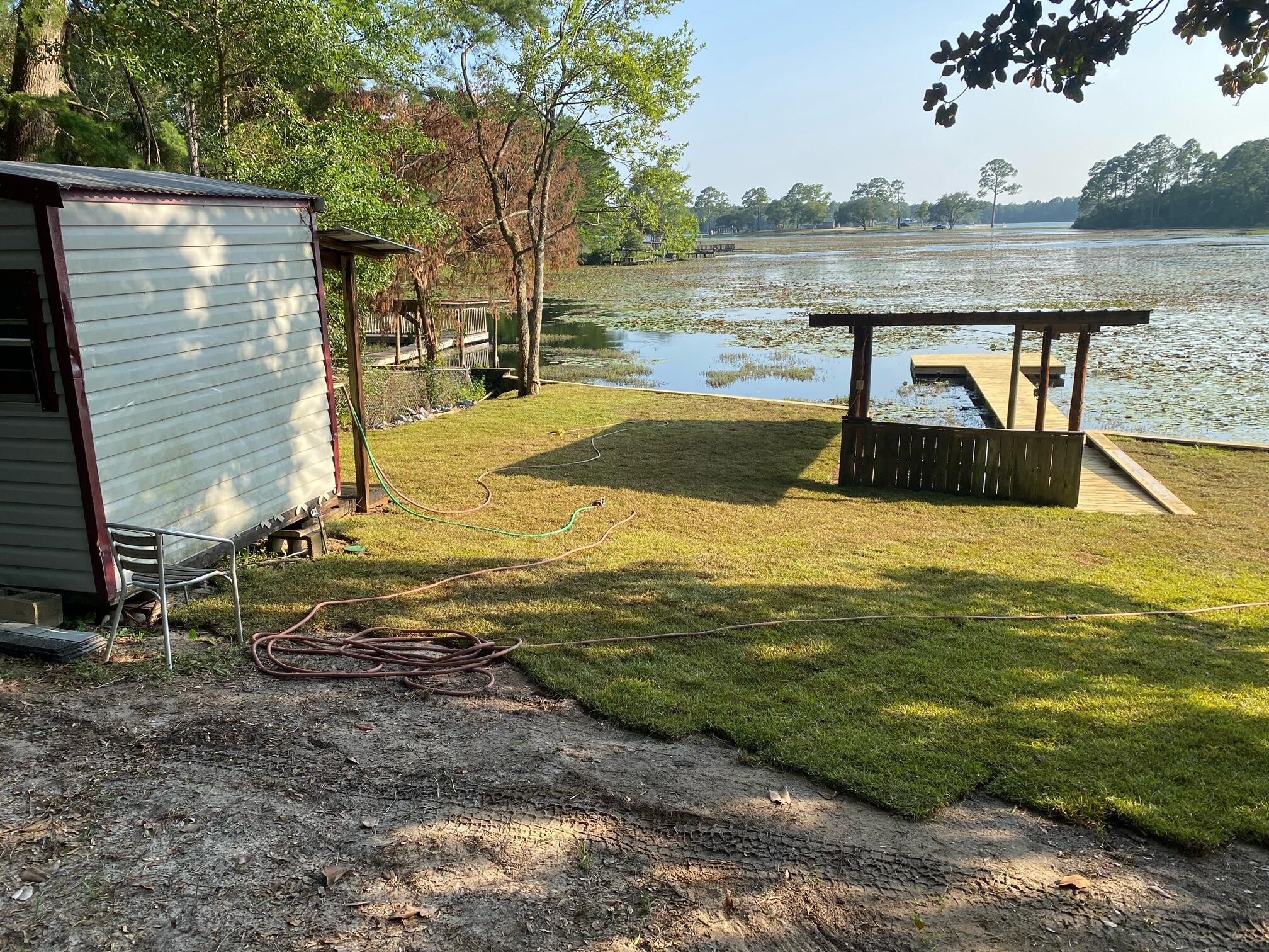 679 Squirrel Road DeFuniak Springs, FL 32433 - Photo 56 of 57 a view of a lake with a yard