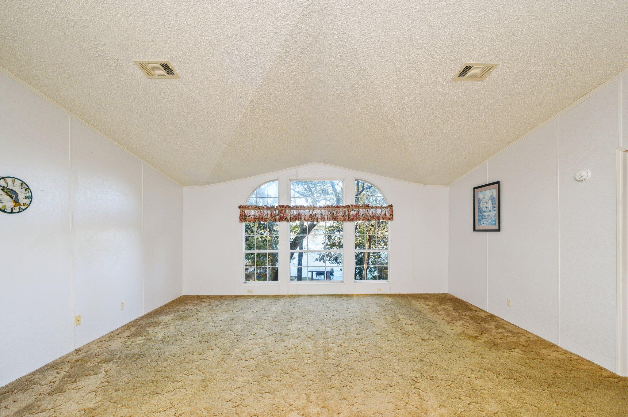 679 Squirrel Road DeFuniak Springs, FL 32433 - Photo 10 of 57 an empty room with windows