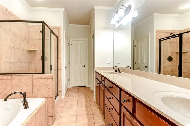 a spacious bathroom with a bathtub sink and mirror