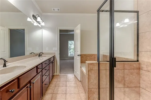 a bathroom with a double vanity sink and a mirror